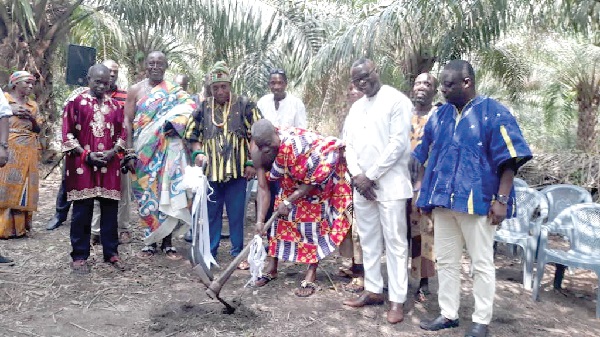 Daasebre Kwebu Ewusi (3rd from right) cutting the sod for work to begin. With him are other dignitaries