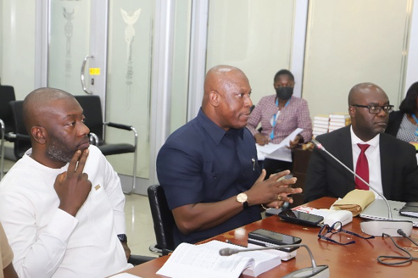 Ato Afful (2nd from left), Managing Director of the Graphic Communications Group Limited (GCGL), answering questions at  the PAC sitting in Accra. Those with him are  Kojo Oppong Nkrumah (left), Minister of Information, and Samuel Essel (right), Director of Finance of the GCGL. Picture: GABRIEL AHIABOR