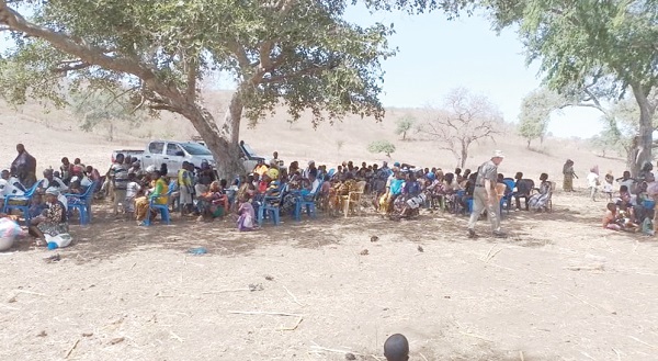 Some of the Burkinabes under a tree waiting for the distribution of relief items