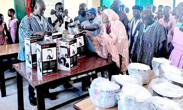 Mohamed Mustapha Yakubu (arrowed), Headmaster of TAMASCO, showing some of the equipment supplied by Geodrill in the Food and Nutrition classroom after the inauguration ceremony