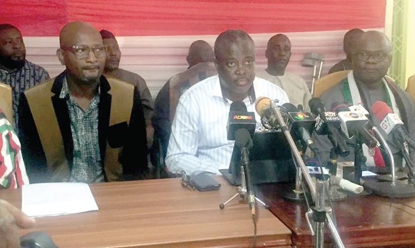  Prof. Richard Asiedu (middle), NDC Central Regional Chairman, addressing the press conference. With him are some senior members of the party in the region