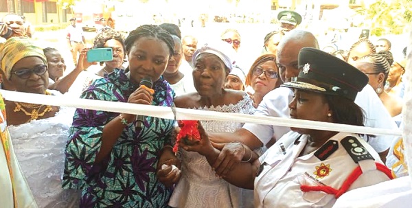 Justina Marigold Assan, the Central Regional Minister, and members of the Edwin Ekow Blankson family inaugurating the building