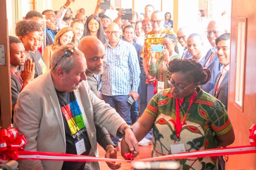Dr Lucy Agyepong (right), Dean, Faculty of Engineering, Academic City University College, being assisted by Rod Crawford (left), Director, Software Technologies, Arm limited, and Stephen Ozoigbo (2nd from left), Senior Director, Emerging Economies, Arm, to cut tape to inaugurate the Academic City Ecosystem Lab. PICTURE: MAXWELL OCLOO