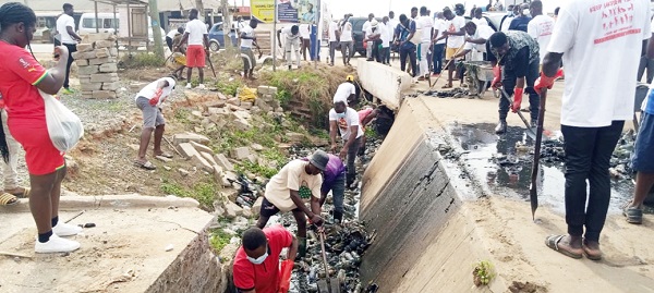 Community members desilting a drain during the clean-up exercise