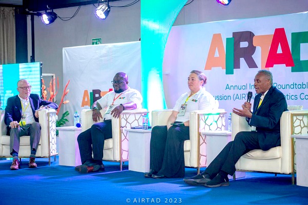 •  Japhet Aryiku (right), Executive Director of Helping Africa Foundation, explaining a point during the panel discussions