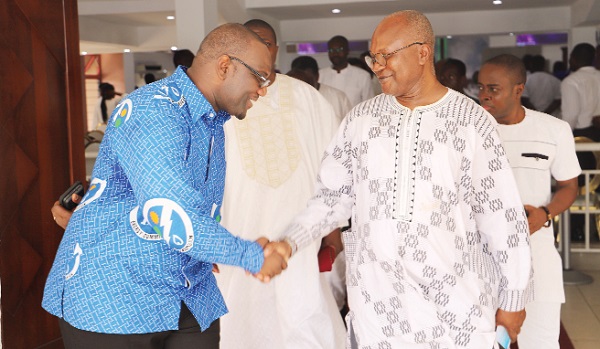 Rev. Oscar Amonoo-Neizer (left) Executive Secretary, Energy Commission, exchanging pleasantries with Dr Ofosu Ahenkorah, a former Executive Secretary of the institution after the thanksgiving service in Accra. Picture: SAMUEL TEI ADANO