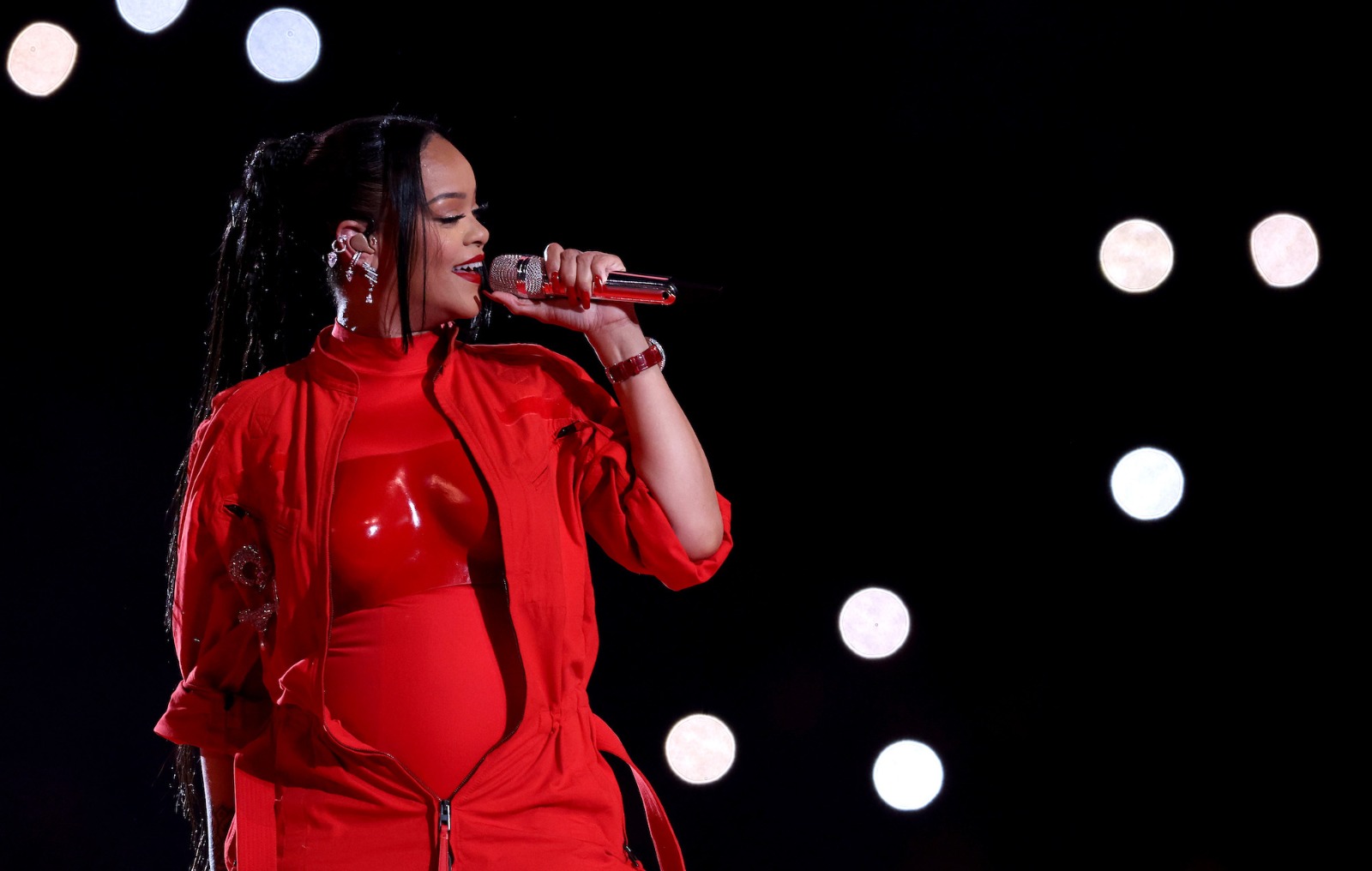 Rihanna returns to the stage triumphant - and pregnant - for Super Bowl halftime show