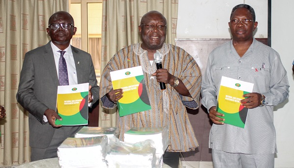 Dr Kwaku Afriyie (middle), Minister of Environment, Science, Technology and Innovation, and Executive Oversight, Ghana AIDS Commission, launching the National AIDS Spending Assessment Report 2019, 2020, 2021. Assisting him are Dr Kyeremeh Atuahene (right), Director-General, GAC, and Prof. Felix Ankomah Asante (left), Pro-Vice-Chancellor, Research, Innovation and Development, University of Ghana. Picture: MAXWELL OCLOO