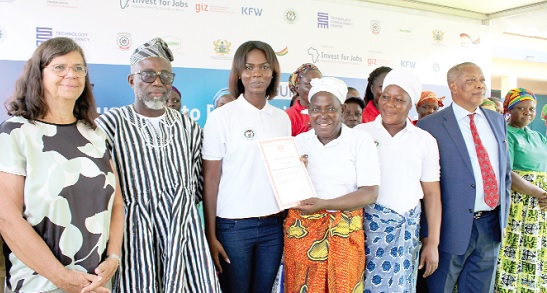Madam Babalimbi Turzuah, Chairperson of  LEWSA, showing off her certificate after receiving it from the GIZ officials