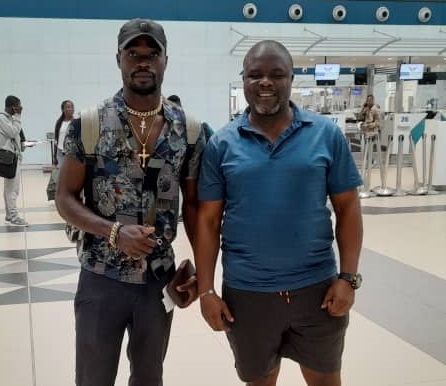 Junior Kaaba (left) on his way back to Cameroun