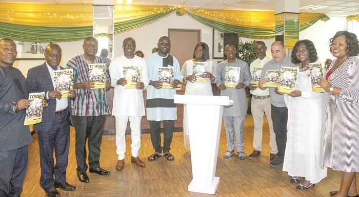 Alisa Osei-Asamoah (6th from left), President of Tour Operations Union of Ghana, declaring the second newsletter duly launched. With her are Charles Adu-Gyamfi (2nd from left), President of Ghana Tourism Fideration, and Ekow Sampson (3rd from left), Deputy CEO in charge of operations, Ghana Tourism Authority, and other dignitaries. Picture: ERNEST KODZI