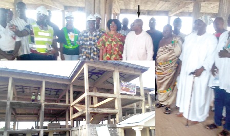 Akwasi Acquah (arrowed), the MP for Oda; Victoria Adu (5th from left), the MCE, and the staff of Setalexidan Company Limited, at the first floor of the abandoned building. INSET: The front view of the three-storey office accommodation building
