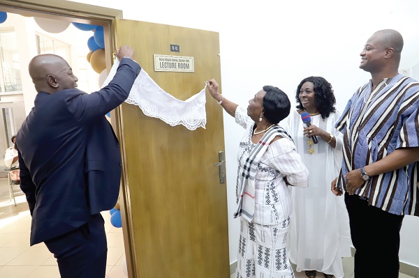 Moses Kwesi Baiden Jnr. (left), CEO, Margins Limited, together with Georgina Baiden (2nd from right), spouse of the late husband, unveiling the plaque to inaugurate the Moses Kweku Baiden Snr. Lecture Hall at the University of Ghana, Legon. With him is Prof. Raymond Atuguba (right), Dean of the Law Faculty. Picture: SAMUEL TEI ADANO