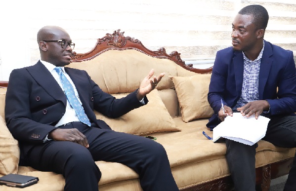  Godfred Dame (left),  Attorney-General and Minister of Justice, explaining a point to Ebo Hackson (right), Senior Reporter, Daily Graphic, on issues relating to his ministry. Picture: SAMUEL TEI ADANO