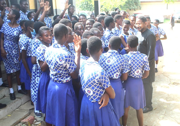 Abdourahamane Diallo (right), ­­­Head of Office and Representative of UNESCO to Ghana, interacting with some pupils of the Osu Presbyterian Basic School during the International Day of Education held in Accra. Picture: ESTHER ADJORKOR ADJEI