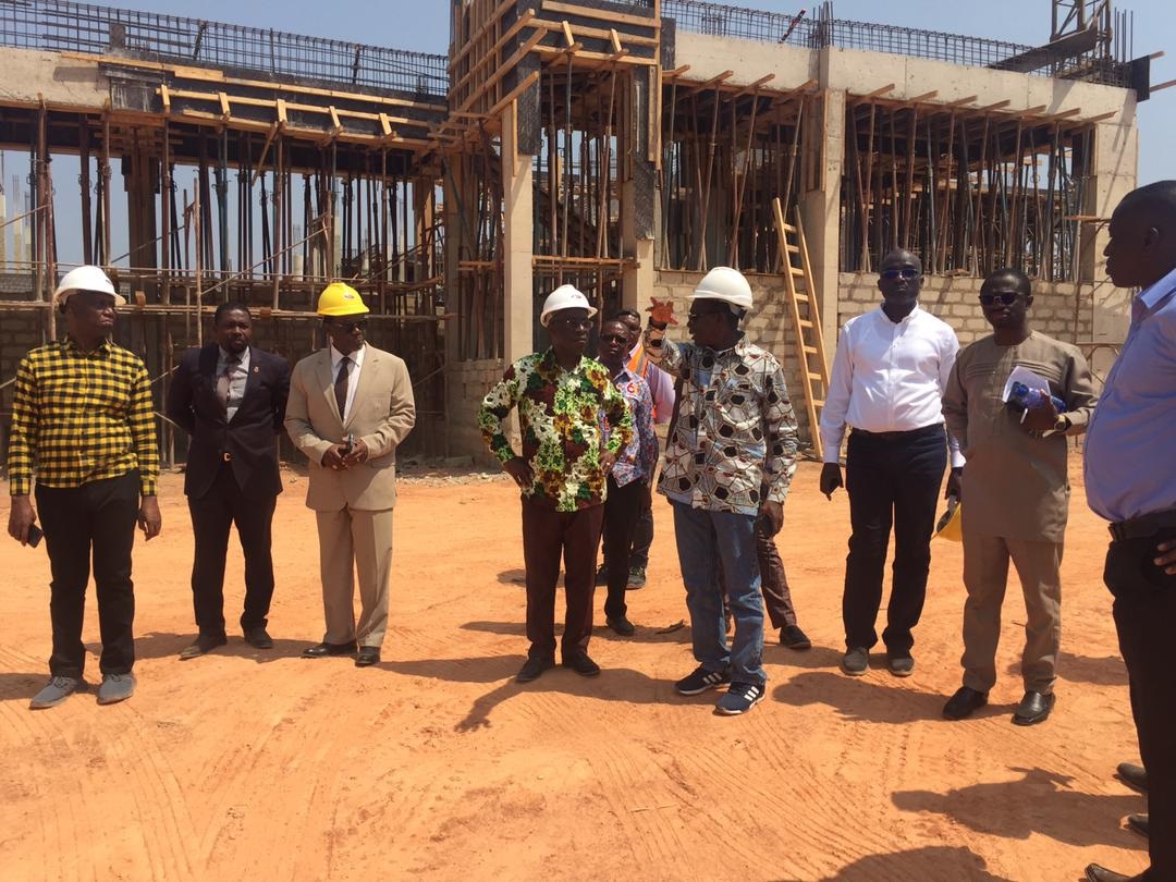 Members of the Governing Council of the UCC at a construction site on an encroached portion of the university’s land