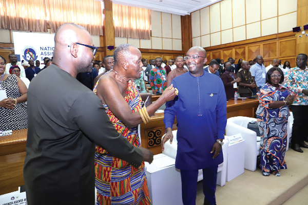 • Vice-President Dr Mahamudu Bawumia (right) interacting with Nana Otuo Siriboe II (middle), Chairman of the Council of State, after the launch of the National Rental Assistance Scheme in Accra. With them is Francis Asenso-Boakye (left), Minister of Works and Housing. Picture: SAMUEL TEI ADANO