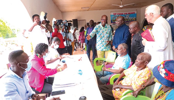 The Vice-President, Dr Mahamudu Bawumia, being briefed during registration of the cured lepers for the Ghana Card by the NIA at the Weija Leprosarium in Accra