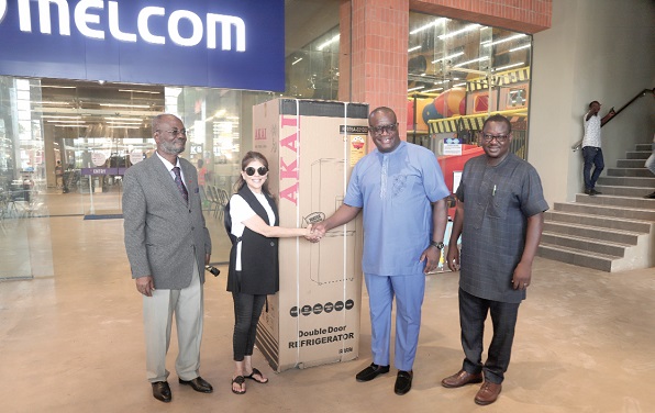 Theophilus Yartey (2nd from right), Editor, Graphic, receiving the refrigerator from Sonya Sadhwani, Group Executive Director, Melcom Group. With them are Godwin Avenorgbo (left), the Group Director of Communications of Melcom, and Samuel Doe Ablordeppey, the News Editor, Daily Graphic