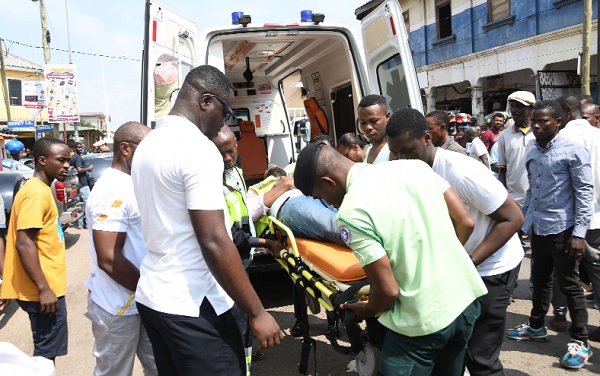 A victim of the fire outbreak being rescued by personnel of the National Ambulance Service during the simulation. Pictures: EBOW HANSON  
