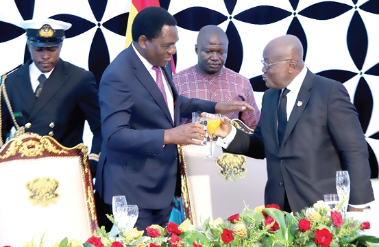 President Akufo-Addo (right) proposing a toast to Hakainde Hichilema, President of Zambia, at a dinner held at the Jubilee House in Accra. Picture: SAMUEL TEI ADANO