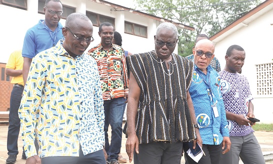 Emmanuel Ofoe Fiemawhle (3rd from right), Headmaster of Accra Academy Senior High School, explaining a point to Kofi Agyarko (left), Director, Renewable and Energy Efficiency, Energy Commission, after the event. With them are Edwin Tamakole (2nd from right), Senior Officer, Energy Efficiency Regulations, Energy Commission, and other officials of Accra Academy Senior High School and the Energy Commission. Picture: EDNA SALVO-KOTEY