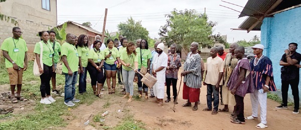  Aba Amprofi-Halm (with shovel), President of the association, performing a symbolic sodcutting at the proposed site of the project. With her are some members of the association and community leaders