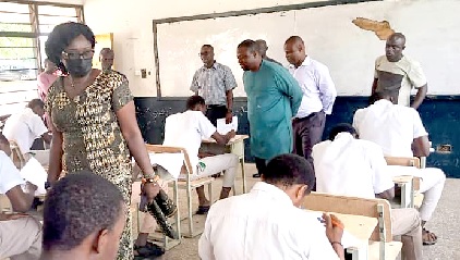 Gifty Twum Ampofo (left), Deputy Minister of Education, at one of the centres observing the conduct of the examination. With her are some officials of the Education Ministry including Dr Fred Kyei Ampofo (arrowed), the Director-General of TVET 