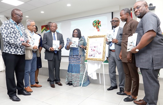 Akosua Frema Osei Opare (4th from left), Chief of Staff, displaying a copy of the National Medical Oxygen Policy Document in Accra. With her are Kwaku Agyeman-Manu (3rd from left), Minister of Health; Dr Patrick Boakye Yiadom (2nd from right), Chairman of the Health Committee of Parliament; Dr Francis Chisaka Kasolo (left), WHO Representative, and other officials.   Picture: SAMUEL TEI ADANO