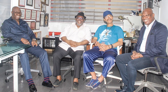 Reginald Laryea (left), President, Dream Child Foundation, interacting with Ato Afful (right), MD, Graphic Communications Group Limited.  with them are Kofi Amoakohene (2nd from left), co-Founder, DreamChild Foundation and Olorogun Oskar Ibru (2nd from right), Chairman, DreamChild Foundation. Picture: ERNEST KODZI