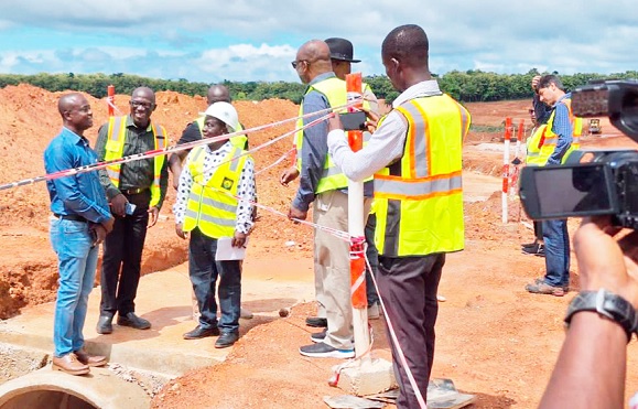 Isaac Afum, Chief Executive Officer of Ashanti Ports Services and leader of the delegation being briefed by some workers on site 