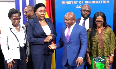 Joseph Cudjoe (3rd from left), Minister of Public Enterprises interacting with Fatimatu Abubakar (2nd from left), Deputy Minister of Information after the press briefing in Accra. Picture: ELVIS NII NOI DOWUONA