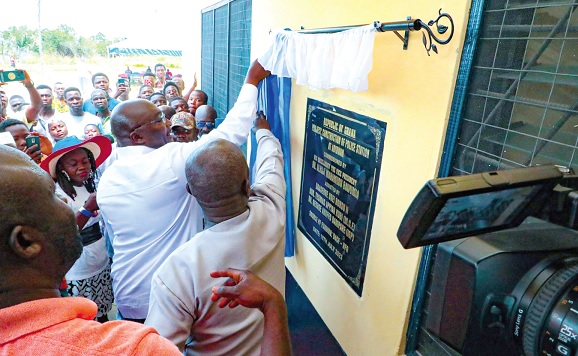 Vice-President Dr Mahamudu Bawumia (arrowed) unveiling a plaque to inaugurate the headquarters building for the newly created Ashanti North Regional Police Command at Mampong in the Ashanti Region. INSET: The headquarters building
