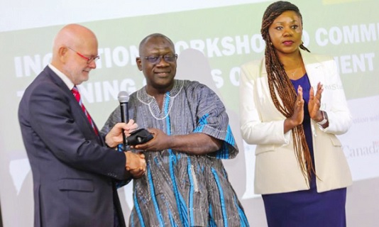 Jeroen Verheul (left), the Netherlands Ambassador to Ghana, presenting the document security magnifiers to Osei Bonsu Amoah (middle), Minister of State, Ministry of Local Government, Decentralisation and Rural Development. With them is Henrietta Lamptey, the Ag. Registrar of Births and Deaths