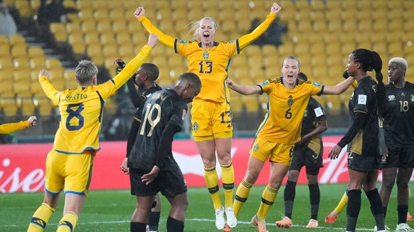Sweden players celebrate a second goal and a famous victory against South Africa