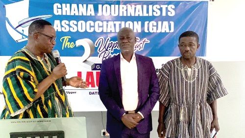 Rex Asanga (left), Municipal Chief Executive for Bolgatanga, swearing in the members of the Awards Vetting Committee