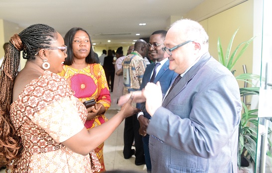 Francisca Oteng Mensah (left), Deputy Minister of Gender, Children and Social Protection, in a chat with Alessandro Fabbiosi (right), Regional Project Director, and Modeste Krah (2nd from right), Regional Project Manager, both of Expertise France, a technical cooperation agency, at the ECOWAS regional meeting in Accra 