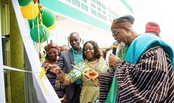 Tongraan Kugbilsong Nanlebegtang (right), Paramount Chief of the Talensi Traditional Area, cutting the tape to inaugurate the facility while Perpetual Ofori-Ampofo (middle), President of GRNMA, and Thomas Lambon, Upper East Regional Chairman of the GRNMA, look on