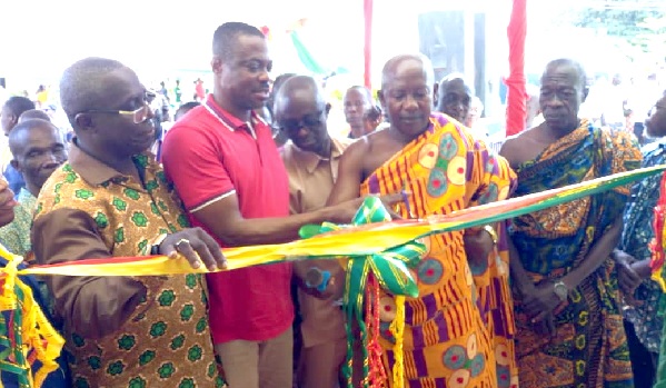 The newly constructed 10-room Special Ward for the Goaso Government Hospital. Inset: Evans Opoku Bobie (2nd from left), MP for Asunafo North, being assisted by Nana Appiah Kubi (2nd from right), Yaw Krahene and Dr Samuel Kwabena Boakye-Boateng (left), Ahafo Regional Health Director, to cut the tape to open the facility