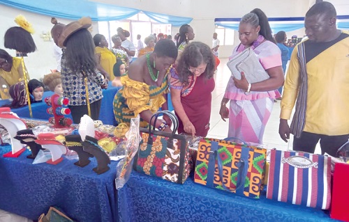 Regina Bauerochse (arrowed), Country Director, GIZ, together with other guests inspecting some of the finished products of the beneficiaries