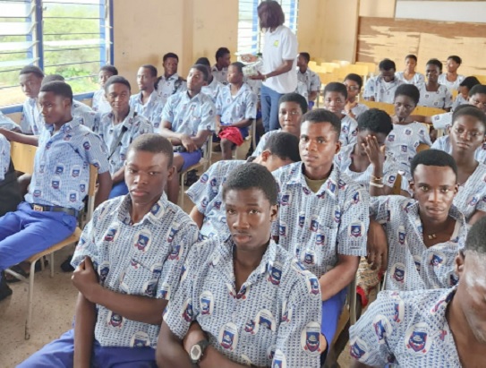 Petrine Addae (arrowed), a member of the Asante Professionals Club, talking to students of the Juaso Senior High and Technical School