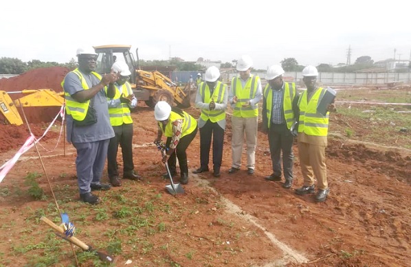 Professor Nana Aba Appiah Amfo  (with shovel), Vice-Chancellor of the University of Ghana, cutting the sod for the commencement of the project