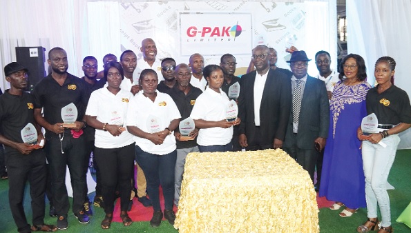 Dr Valentine Mensah (4th from right), Board Member, GCGL, with Nana Otuo Acheampong (3rd from right), a former Board Chairman, G-Pak Limited; Ato Afful (arrowed), Board Chairman, G-Pak Limited, and the award winners. Picture: ELVIS NII NOI DOWUONA