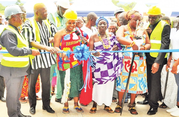 Mama Nyabor VII (3rd from left) cutting the tape while Dr Letsa (left), Mahama Asei Seini (2nd from left) and others look on. INSET: The medical waste facility 