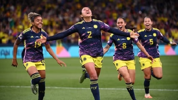Manuela Vanegas and teammates celebrate scoring a goal