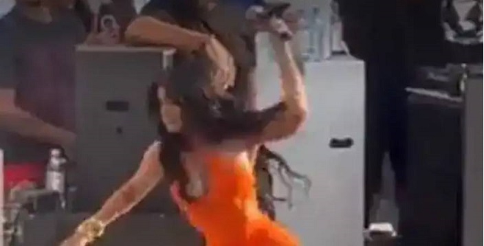 Cardi B angrily throws microphone at fan who tosses drink at her on stage