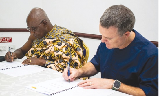 David Thornton (right), Regional Senior Vice President  for Newmont Africa, and Nana Prof. Oheneba Boachie-Adjei Woahene II, the Chairman of the Otumfuo Foundation, signing the MoU