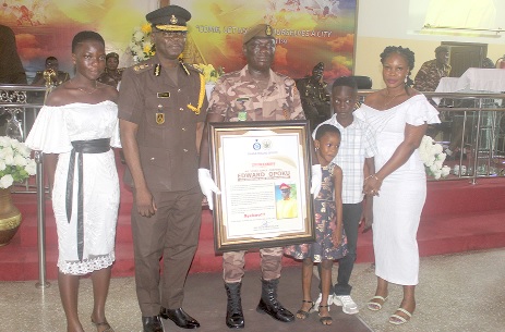 Isaac Kofi Egyir (2nd from left), Director-General, Ghana Prisons Service, with Cpl Edward Opoku (3rd from left) and his family after the ceremony. Picture: ESTHER ADJORKOR ADJEI