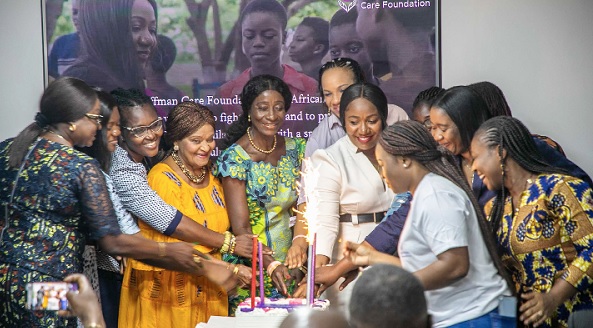 Dr Bernadette Hoffman (arrowed), the Founding President of the foundation, cutting a cake with some of the guests to officially launch the foundation 