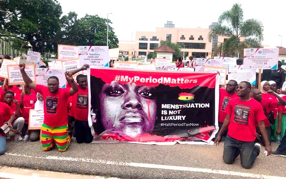 Some members of the civil society organisations with placards kneeling down to dramatise the event